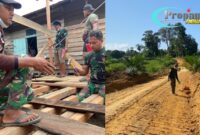 Foto : Anggota Satgas bahu-membahu membangun jalan penghubung antar desa, jembatan, serta sasaran fisik lainnya